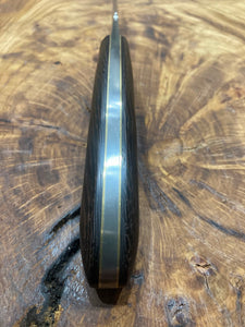 Small false edge hunter with false edge and pocket sheath
